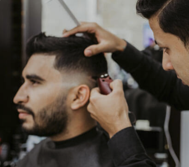 Barber cutting a man's hair